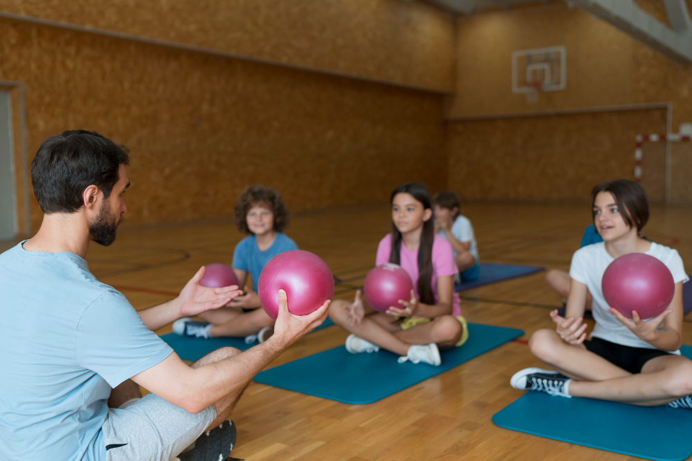medium-shot-kids-yoga-mats-with-pink-balls